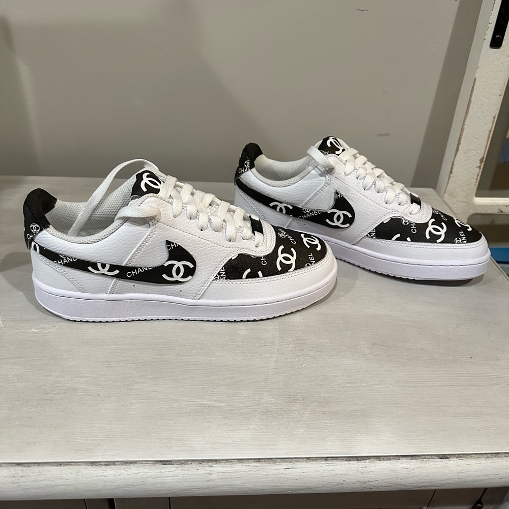 Nike low court sneakers.  With added materia
